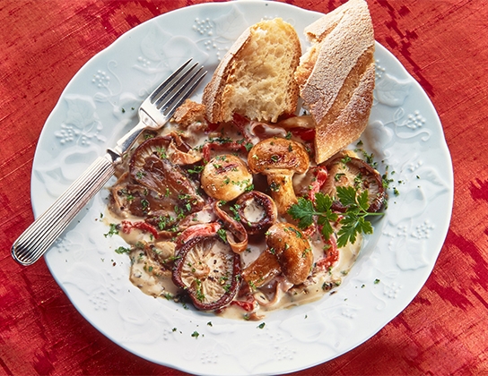 Grilled mushrooms with prosciutto and cream