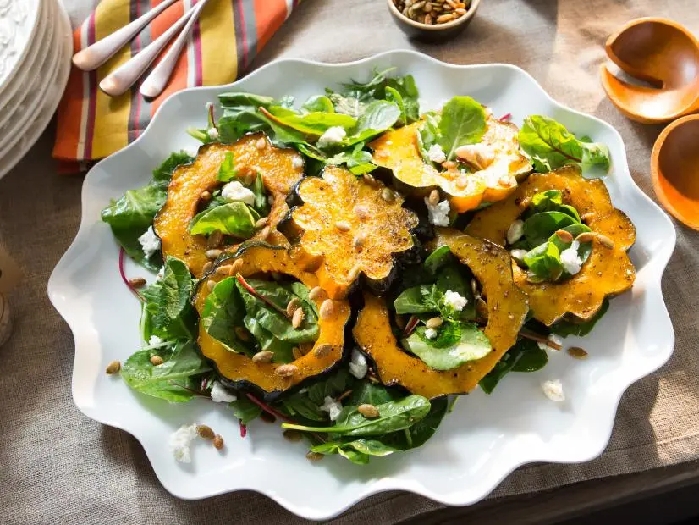 Acorn squash with baby bitter greens recipe