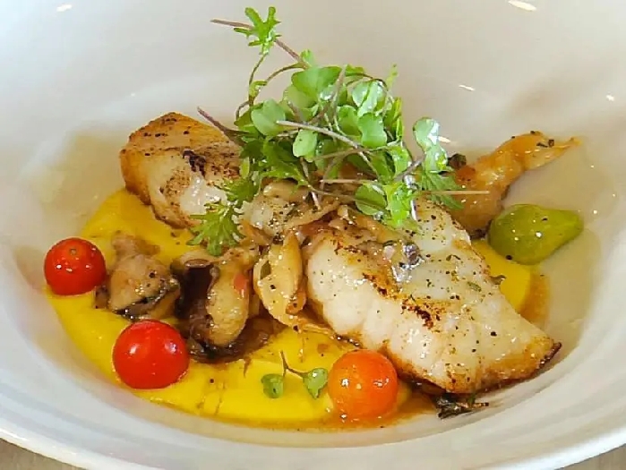 Yellowedge grouper with savory sweet corn pudding, oyster mushroom vinaigrette and petite greens recipe