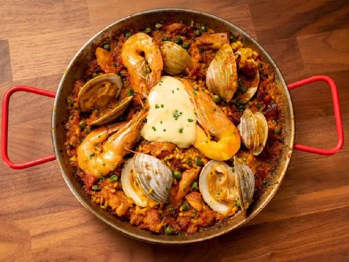 Paella with chorizo, shrimp, clams and chicken with garlic aioli recipe