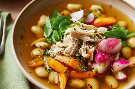 Poached chicken breast in a summer vegetable & butter bean broth