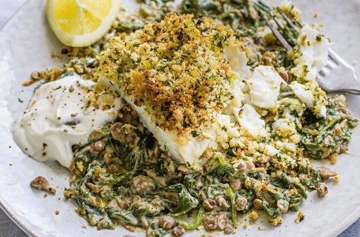 Herby crumbed fish with spinach & yogurt lentils