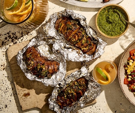 Hasselback sweet potatoes with burnt salad onion butter