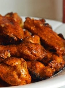 Grilled chicken wings with seasoned buffalo sauce
